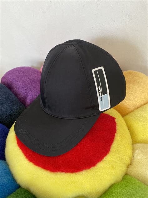 Prada Cappelli IN Tessuto Nero Rubber Tab 018 Hat.